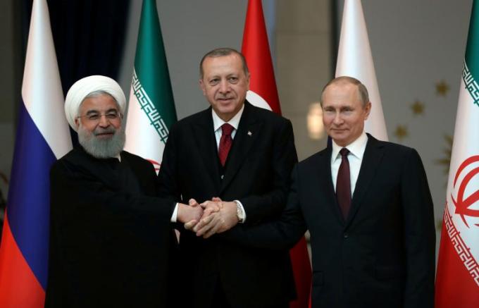 Presidents Rouhani of Iran, Erdogan of Turkey and Putin of Russia pose before their meeting in Ankara